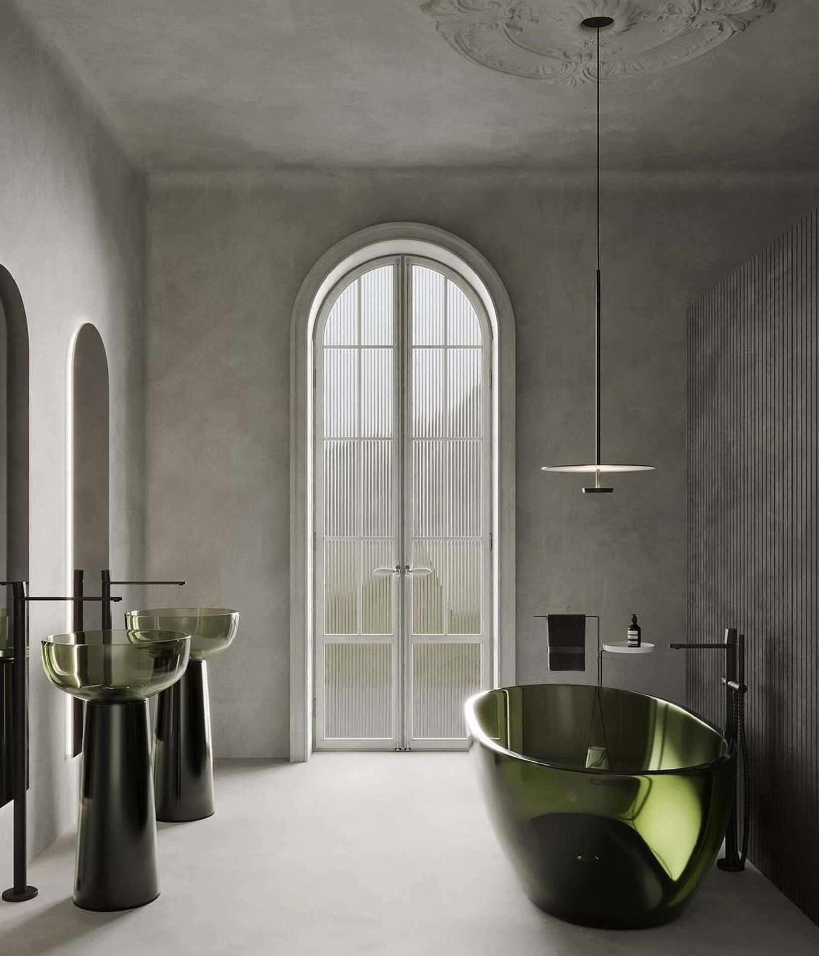 Breathtaking modern hotel bathroom featuring a stunning translucent deep green freestanding bathtub and two matching translucent green pedestal sinks, set within a serene grey textured room with classical arches, a ceiling rose, and a minimalist pendant light.
