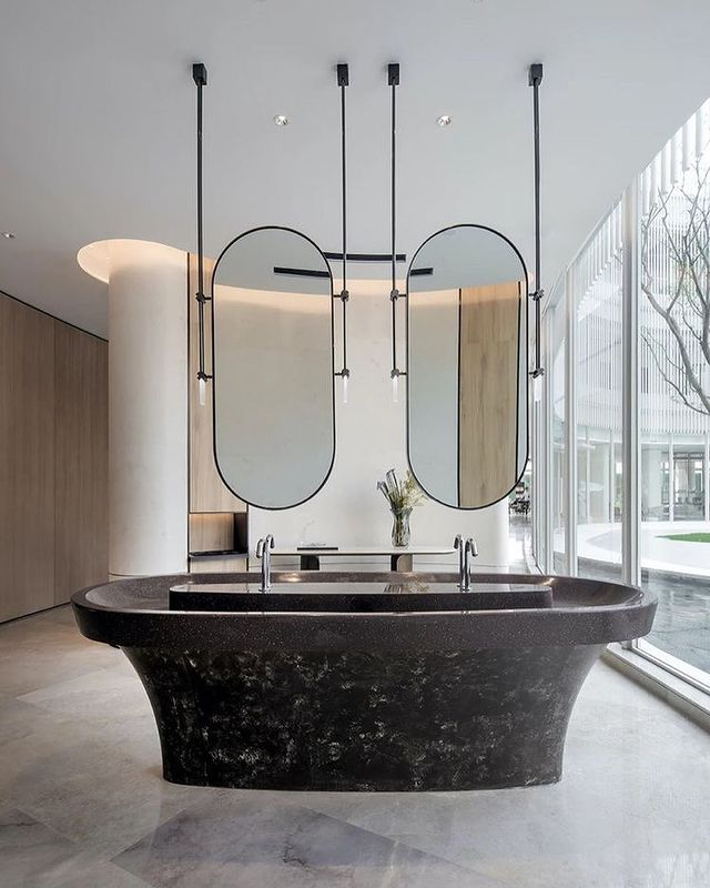 Architectural Statements: The Allure of Island Washbasins & Suspended Mirrors in Modern Bathrooms