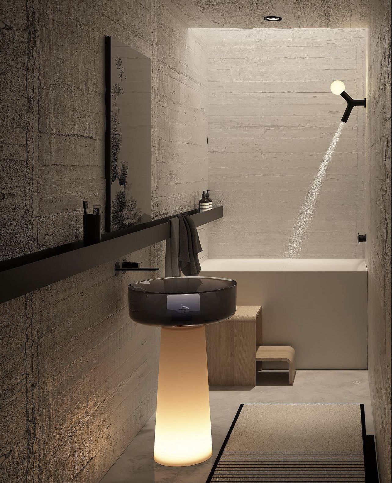 Modern minimalist spa bathroom featuring an illuminated resin pedestal sink with a smoky grey basin, a matte black wall-mounted faucet, and a square solid surface bathtub with a unique Y-shaped showerhead, against textured concrete-like walls.