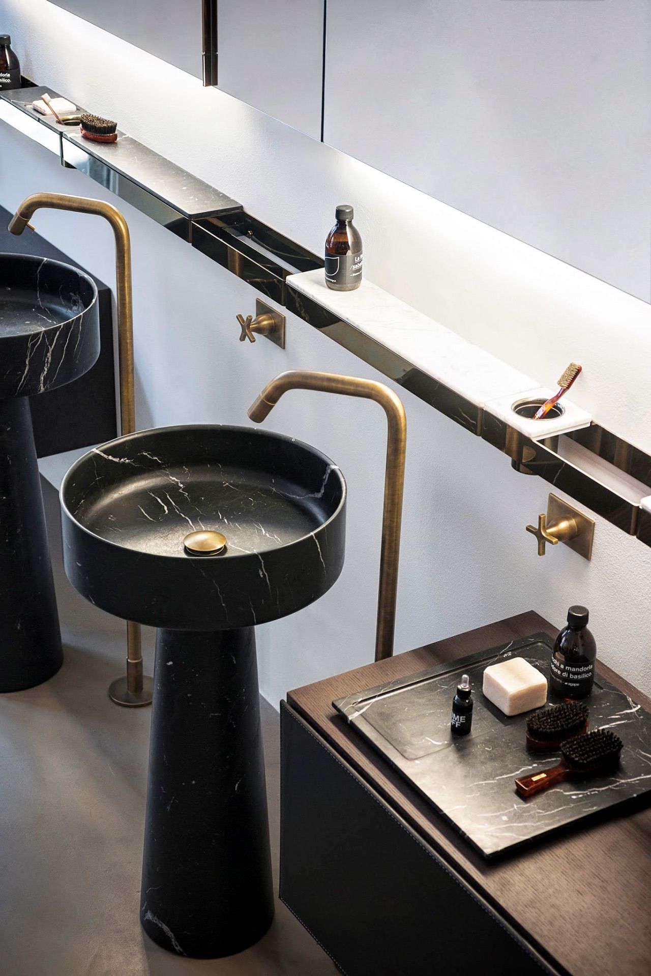 The Pinnacle of Bathroom Opulence: Black Marble Pedestal Sinks