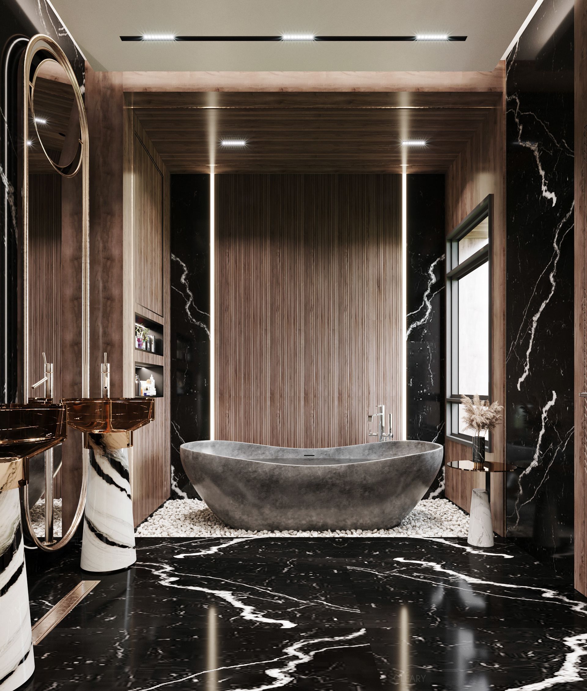 Opulent modern bathroom design featuring a freestanding dark stone bathtub on a bed of pebbles, black marble walls, and custom resin pedestal sinks with bronze vessel basins.