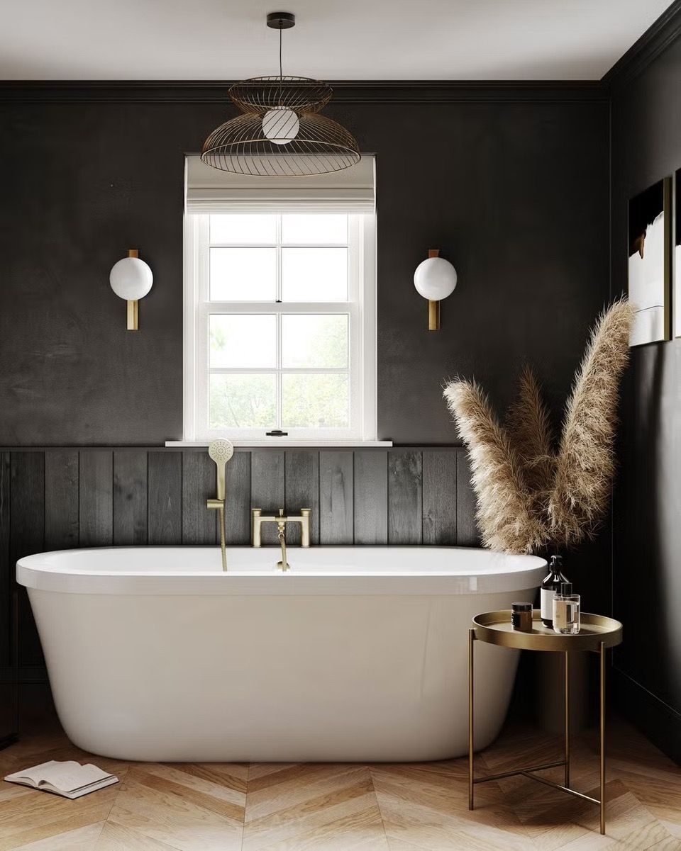 Modern Minimalist Black Bathroom with Freestanding White Bathtub and Golden Fixtures, Creating an Elegant and Luxurious Ambience