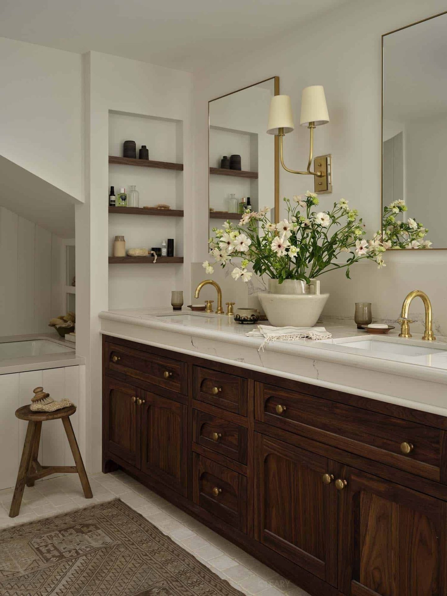 Custom bathtubs, basins, vanities, mirrors, niches and shower trays in solid walnut, mineral composite and brushed brass bring quiet luxury and enduring quality to any neutral-toned bathroom.
