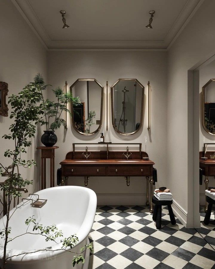 A luxurious 2025 classic European-style bathroom featuring a white freestanding bathtub, a custom dark wood and brass double washstand with integrated white ceramic basins and brass faucets. Twin octagonal/hexagonal mirrors hang above the washstand, set against light neutral walls with high ceilings and detailed crown molding, complemented by a black and white checkerboard marble floor.