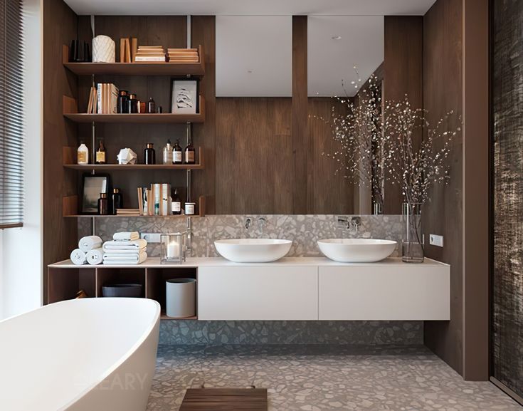 A warm, modern bathroom featuring a white floating double vanity with two round vessel sinks, set against a wood-paneled wall with open shelving and a grey terrazzo backsplash.