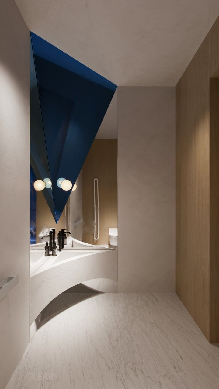 Futuristic modern bathroom featuring a white integrated sculptural vanity sink with black fixtures and a bold geometric cut mirror wall with blue accents.