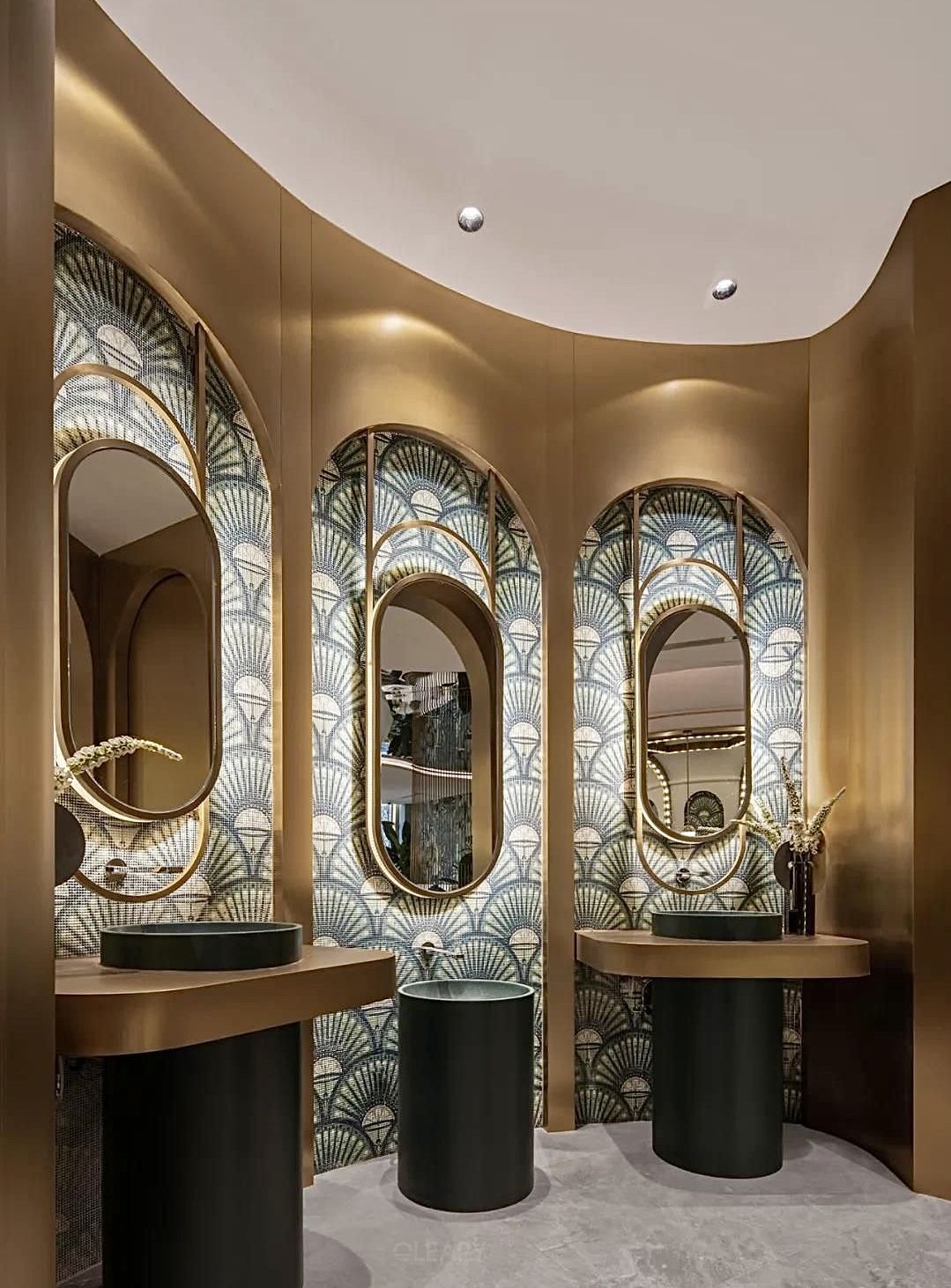Art Deco Reimagined: Designing Luxury Bathrooms with Sculptural Sinks & Golden Oval Mirrors