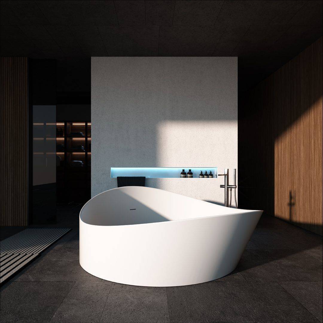A modern minimalist bathroom featuring a unique, wave-like white ergonomic sunken bathtub, seamlessly integrated into the floor in front of a large window overlooking a lush green mountain valley. A black minimalist faucet and a rustic wooden stool complement the serene, nature-connected design.