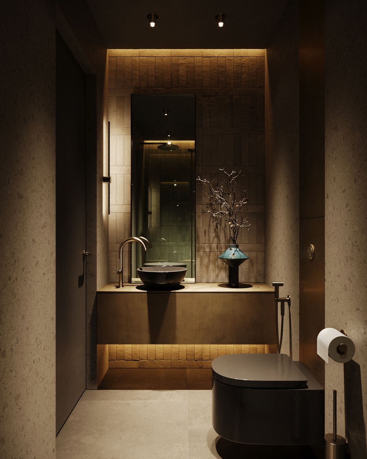 Earthy modern bathroom with a dark bowl vessel sink on a floating warm-toned vanity, illuminated niche with textured tiles, tall mirror, and brass faucet.