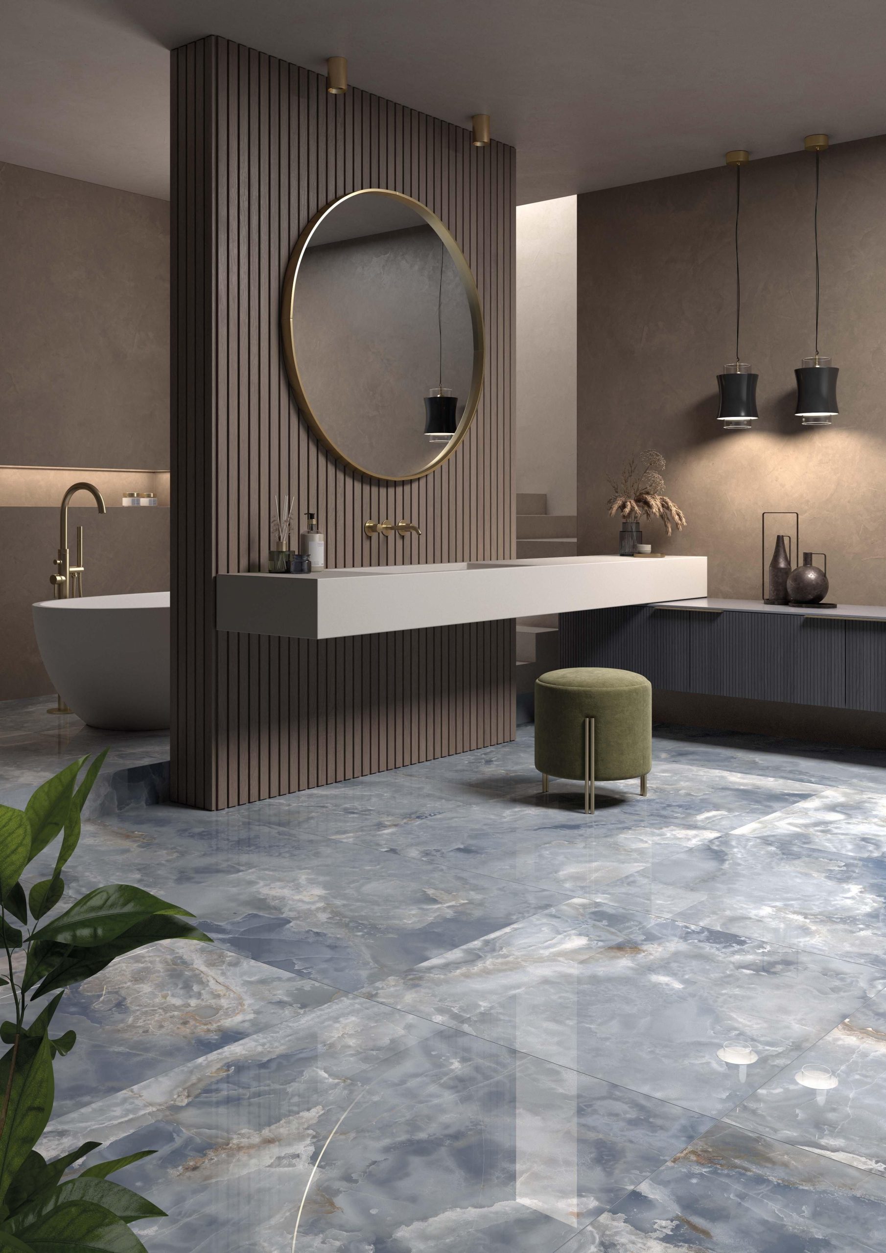Modern floating bathroom vanity with light countertop, integrated sink, gold round mirror, and a vertical wood slat accent wall in a luxurious bathroom with blue marble-look flooring.