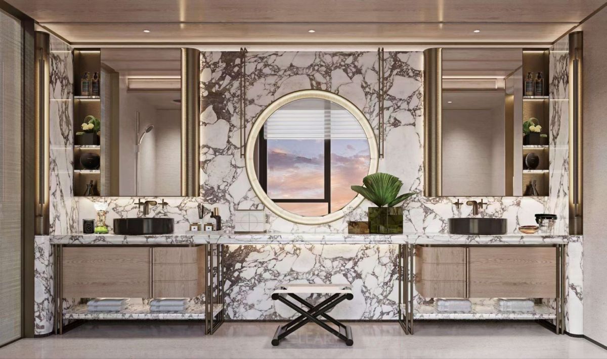 A symmetrical luxury hotel bathroom with dual wood vanities, black vessel sinks, a large marble accent wall, and multiple mirrors including a central round backlit mirror.